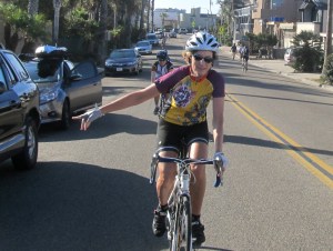 Julie passing along car door warning on Pacific Ave in Oceanside.